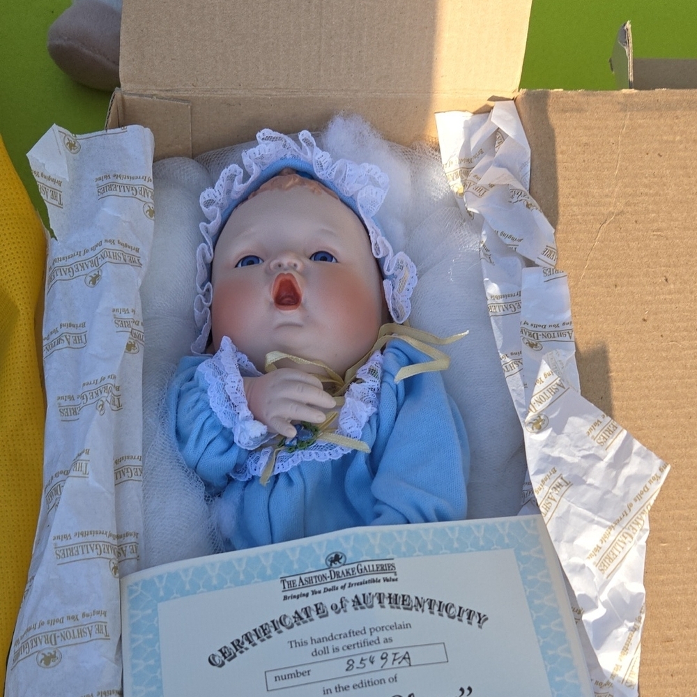 Porcelain Baby Doll in Blue Outfit